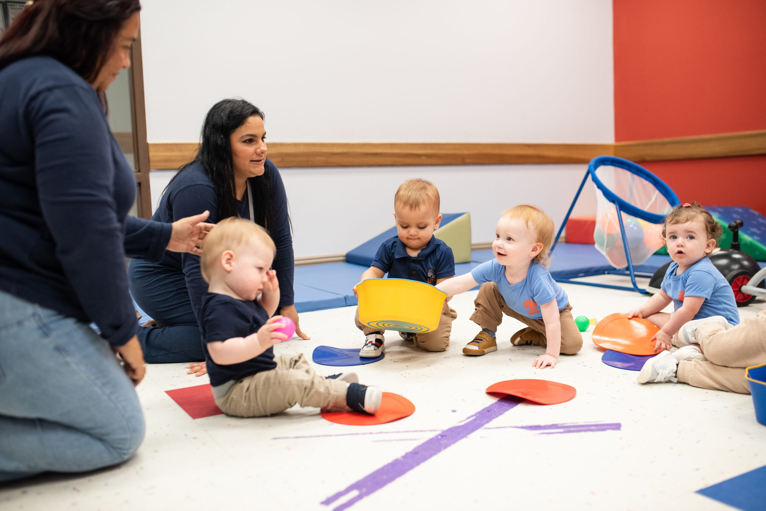INIC Preschool toddlers exploring sensory and language activities with bilingual teachers at our Austin and Round Rock toddler classrooms
