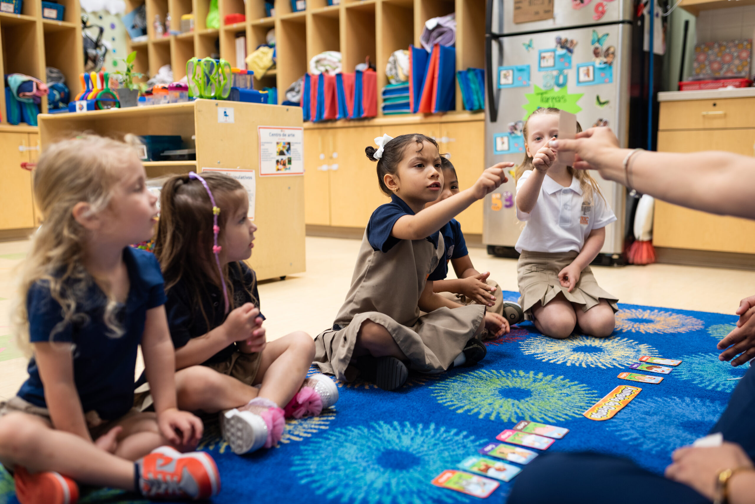 INIC Preschool classroom moment: teachers and young children engaged in Spanish-immersion learning at the South Austin and Round Rock private preschool campus