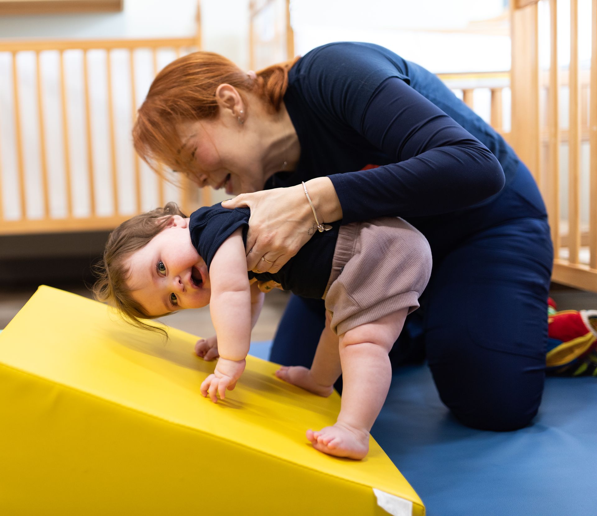 INIC preschool infant teacher leading gross motor play