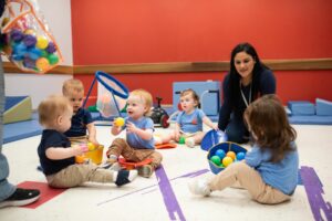 INIC preschool toddlers playing together in a ball pit